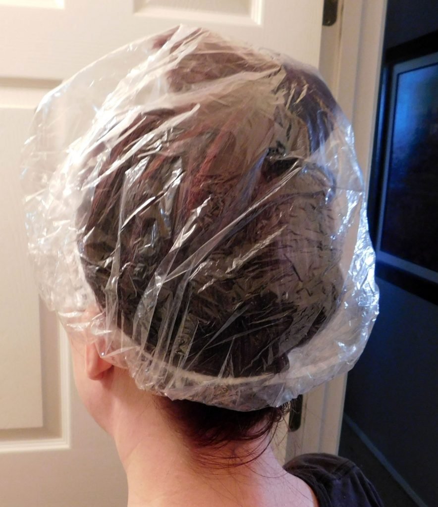 Put your hair in a shower cap to keep the oil on your head and not on your couch.